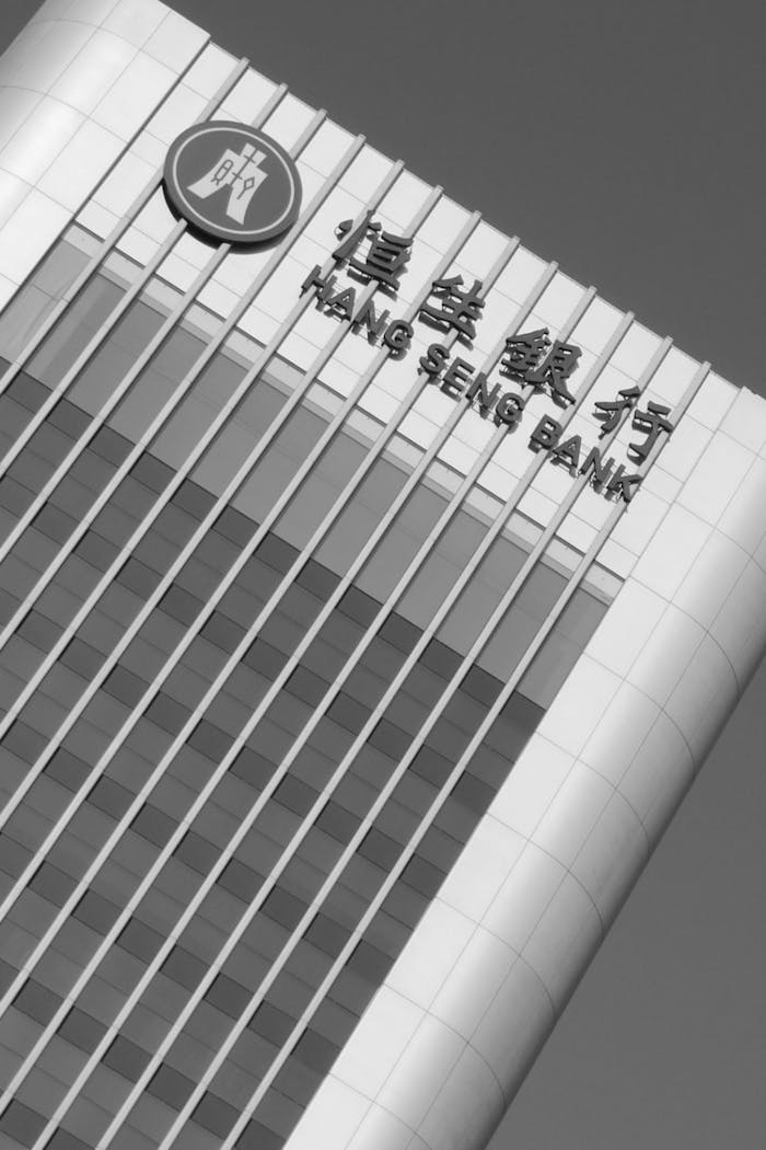 our-stories Stylish black and white facade of Hang Seng Bank skyscraper in Hong Kong.